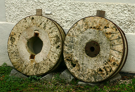 Pair of millstones in front of the old mill